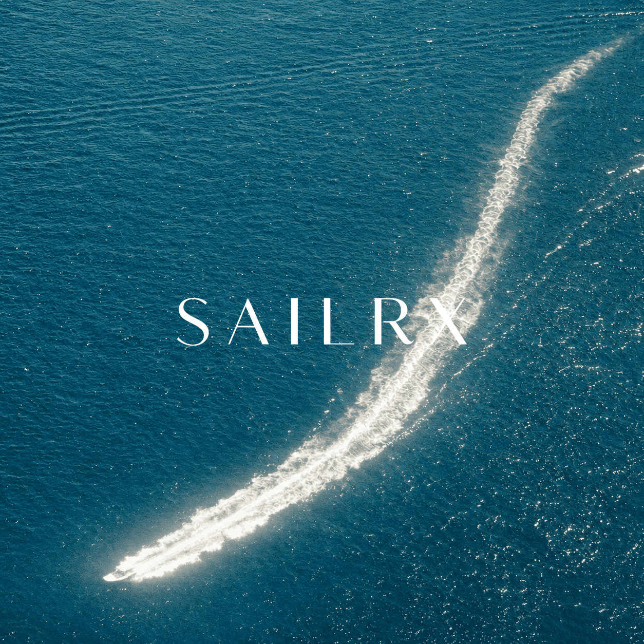 Aerial view of a boat sailing across open water